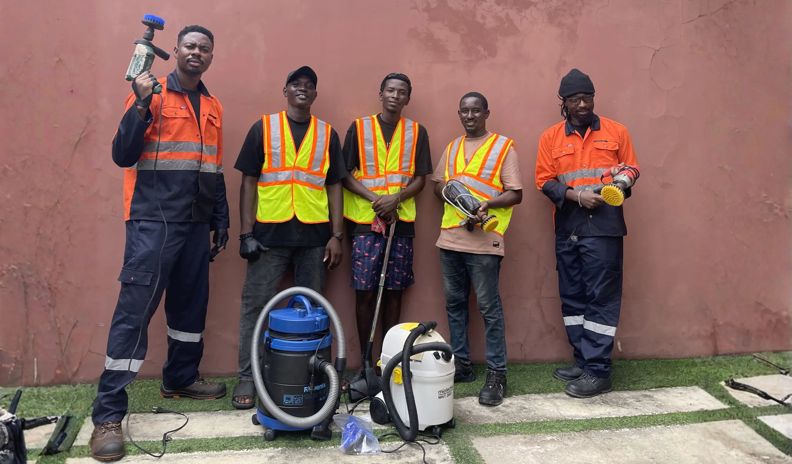 The Happiclean team in branded workwear with their professional cleaning equipment